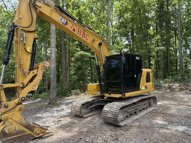 H Buttrey Construction CAT excavator with HBC logo